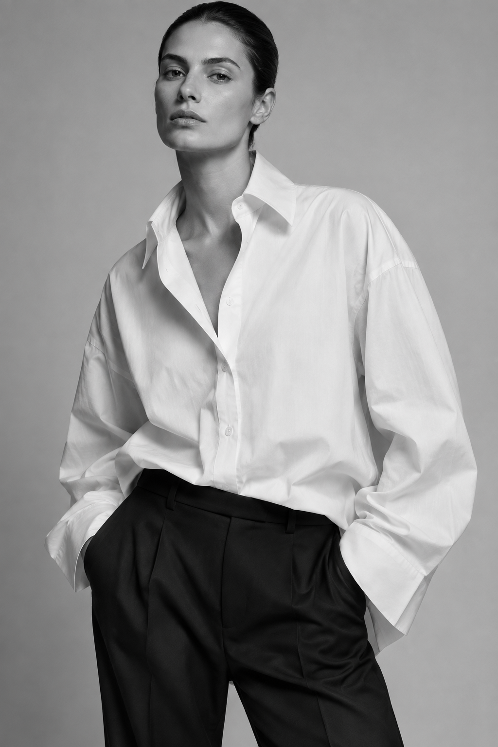 Oversized white shirt with voluminous sleeves and black trousers